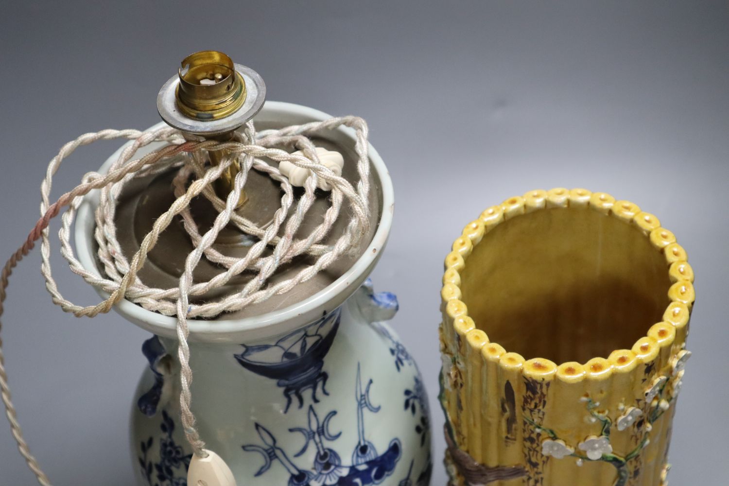 A Chinese blue and white converted lamp, together with a yellow ground cylindrical vase, tallest 33cm